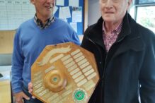 Club President Peter Hyland congratulates John Newton on Club Person of the Year