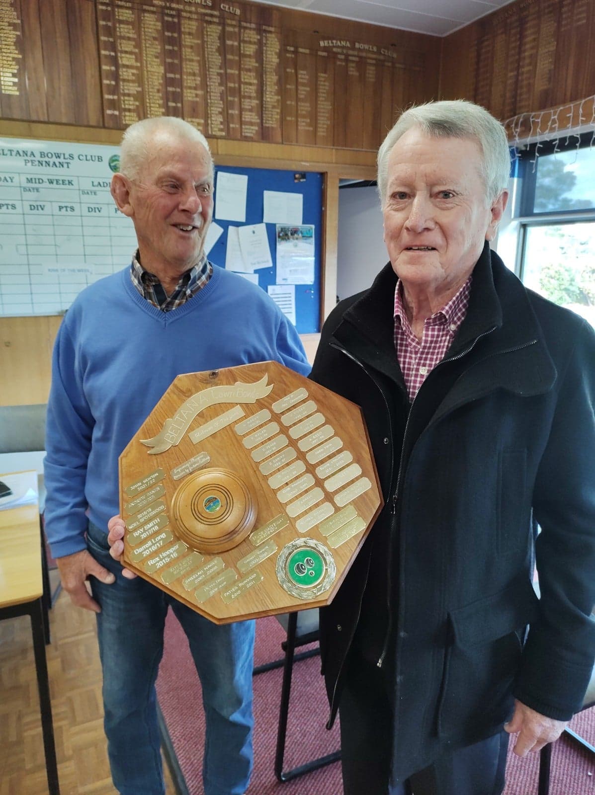 Club President Peter Hyland congratulates John Newton on Club Person of the Year